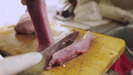 Cutting-raw-fish-into-pieces-to-prepare-ceviche