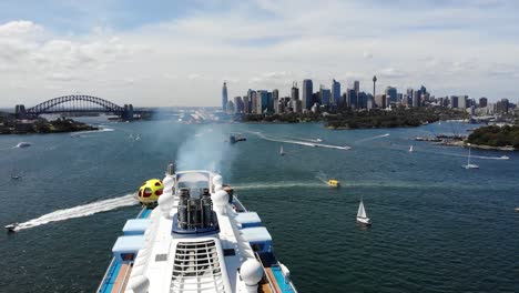 Aerial-shot-of-a-Cruise-Ship-in-Sydney-Harbor-and-city-skyline