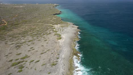Aerial-shot-over-the-emerald-waters-of-Curacao