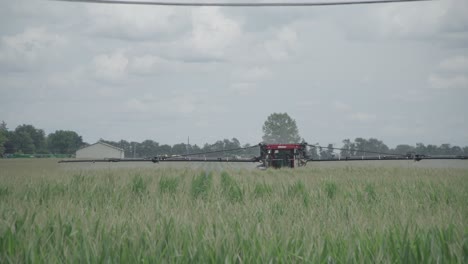 wide-day-exterior-of-crop-dusting-in-corn-field