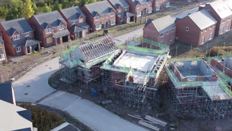 Aerial-view-orbiting-across-suburban-townhouse-framework-on-development-construction-site