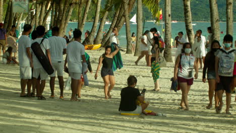 Tourists-swarm-the-white-sand-beach-of-Boracay-as-sunset-nears