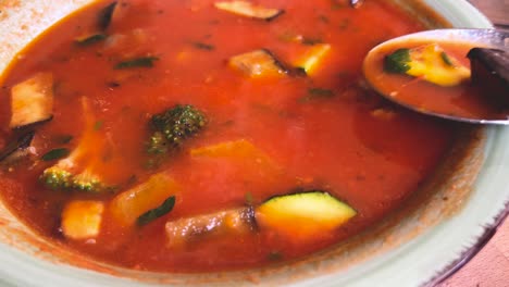 Eating-tasty-minestrone-soup-with-fresh-vegetables