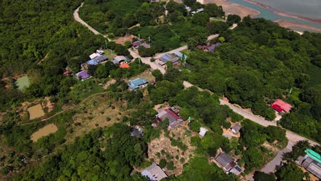 Aerial-view-of-small-houses-in-the-island-near-Koh-Samui,-Thailand