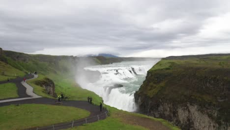 Gullfoss-waterfalls-in-Iceland-with-people-and-drone-video-moving-up