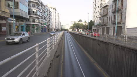 Vehicles-entering-and-leaving-a-road-tunnel-on-Zerkouni-Boulevard,-wide-view