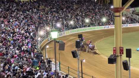 Queensland-Harness-Racing-presented-by-Racing-Queensland-at-Main-Arena-with-legendary-trots-competing-on-the-track-and-audiences-cheering-at-Ekka-Brisbane-Royal-Queensland-Show,-Australia