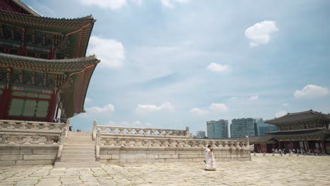 Gyeongbokgung-Palace---Korean-Couple-Wearing-Traditional-Hanbok-Royal-Costumes-Travel-Inside-Geunjeongjeon-Hall-on-Summer-day---copy-space