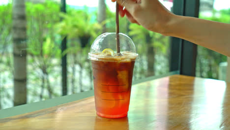 espresso-coffee-shot-with-lemon-peach-soda-glass-in-coffee-shop-cafe