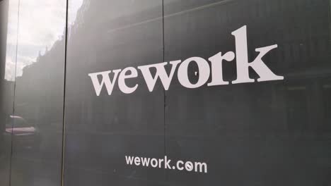 City-of-London-England-September-2022-close-up-of-the-Wework-logo-at-vacant-office