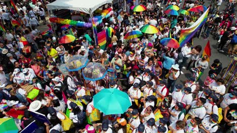 Colorful-rainbow-convoy-cheering-at-the-Gay-pride-of-Mexico-city---aerial-view