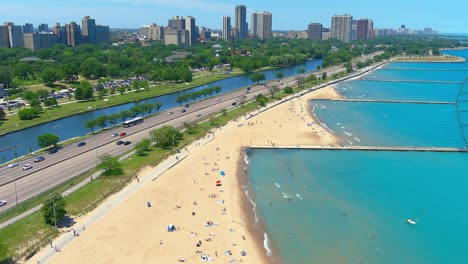 Aerial-flyby-shot-of-North-Avenue-beach-in-Chicago-Illinois-|-Afternoon-lighting