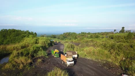 trucks-activity-on-the-sand-mine-on-the-slope-of-the-Merapi-volcano,-Magelang,-central-java,-Indonesia-on-September-4,-2022