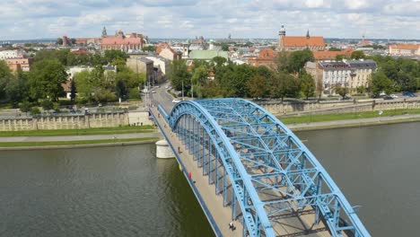 Beautiful-Aeral-View-Above-Jozef-Pilsudski-Blue-Bridge-in-Krakow,-Poland