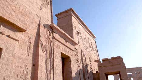 The-entry-of-the-ancient-temple-Philae-with-hieroglyphs-in-Aswan,-Egypt