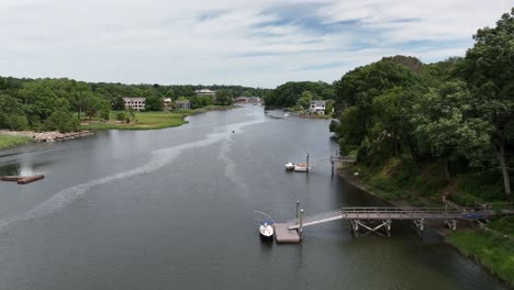 An-aerial-view-over-the-Saugatuck-River-in-Connecticut-on-a-beautiful-day-with-blue-skies-and-white-clouds