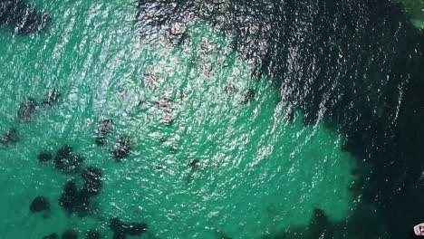 Drone-Flying-over-the-turquoise-Mediterranean-sea-in-Nice-showing-boats