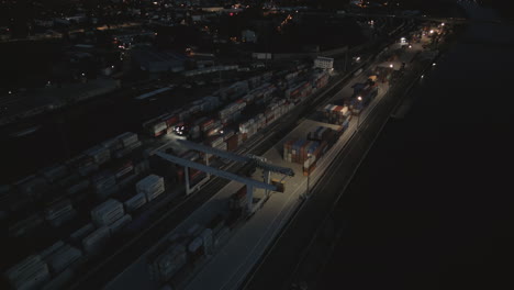 Aerial-view-of-the-night-cargo-port-illuminated-by-lamps