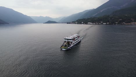 Pontoon-Ferry-Boat-Transporting-Cars-across-Lake-Como-Water-in-Italy,-Aerial-Drone