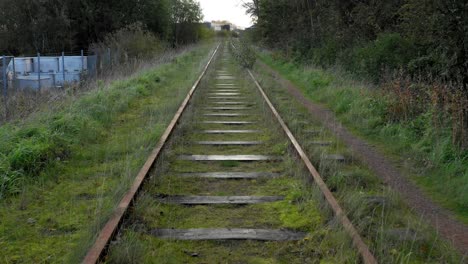Following-old-rusty-abandoned-rail-tracks