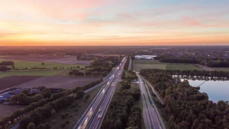 Aerial-hyperlapse-of-cars-traveling-on-highway-at-fall-of-evening
