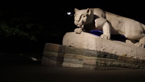 Nittany-Lion-Shrine-at-Penn-State-University-at-night-with-video-panning-left-to-right