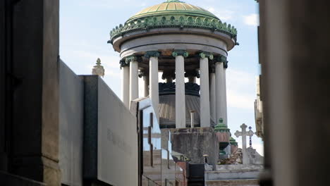 Old-Mausoleum-and-street-in-La-Recoleta-Cementery-at-daytime-tilt-down-to-high