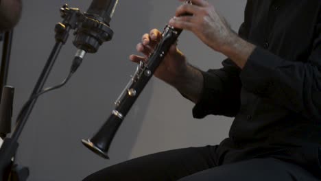 Clarinetist-at-a-concert,-theater-scene,-clarinet,-flat-plane-closeup