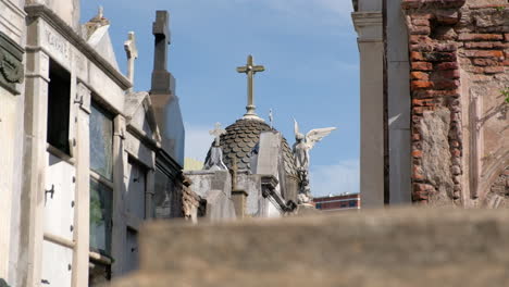 Mausoleum-dome-with-cross-at-daytime-with-out-of-focus-foreground-in-La-Recoleta-Cementery