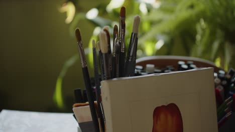 Paint-Brushes-In-Stand-In-Artistic-Workshop-Of-A-Professional-Painter