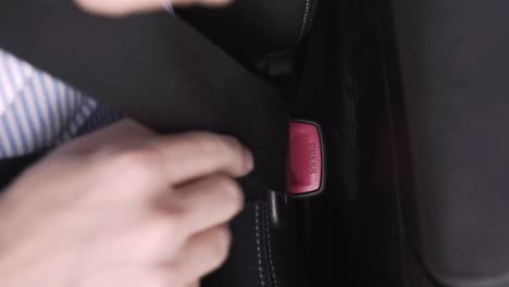 Fastening-the-safety-seatbelt-in-a-car