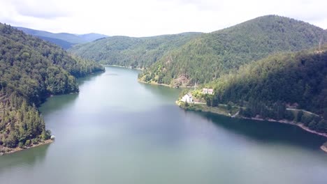 Spinning-aerial-shot-over-the-top-of-a-mountain-lake