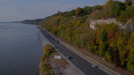Aerial-over-river-road-and-bluffs-pans-left-to-reveal-Mississippi-River