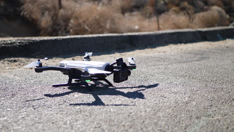 Close-up-on-a-drone-with-an-action-cam-taking-off-in-flight