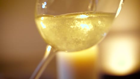 Close-up-of-pouring-champagne-into-glass-in-slow-motion