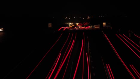 Night-time-time-lapse-of-multi-lane-freeway-with-streaking-lights