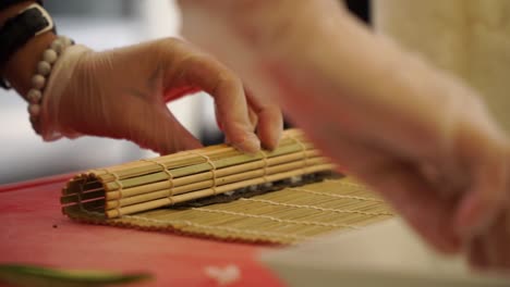 SLOWMO---Japanese-chef-preparing-sushi-rolls