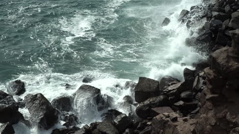 Waves-crashing-on-rocks-in-Chorrillos,-Lima,-Peru-SLOW-MOTION