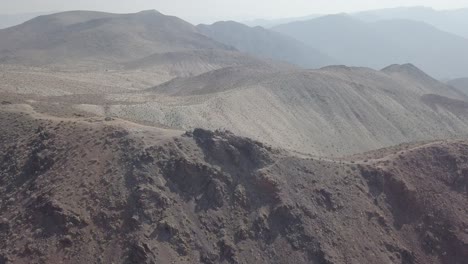 Aerial-Drone-Shot-of-Group-of-People-on-Mountain-in-Death-Valley