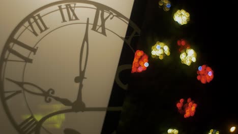 Outdoor-Christmas-decorations-lantern-with-clock-overlay,-blured-Christmas-lights-flashing-in-background,-closeup