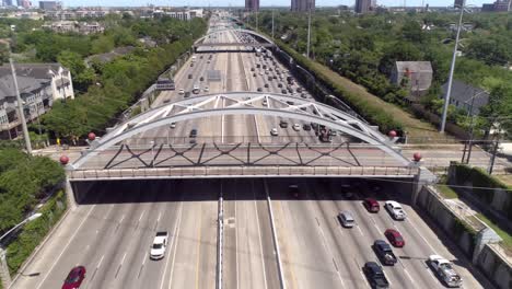 Aerial-view-of-traffic-over-major-freeway-in-Houston,-Texas