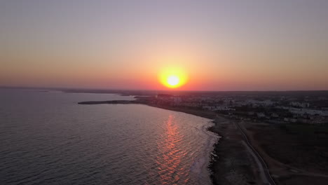 Aerial-shot-of-a-cloudless-sunset-of-the-sea-coast-at-a-holiday-resort