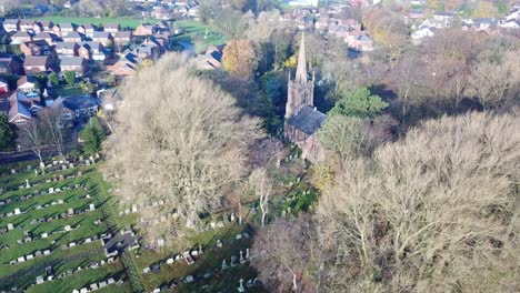 Aerial-ascending-slight-rotation-over-UK-countryside-village---church-in-Autumn-sunrise