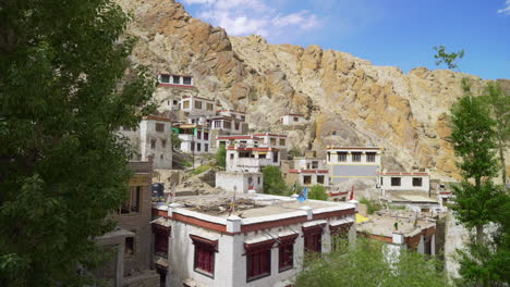 Houses-in-the-mountains-of-Himalaya-in-Ladakh,-camera-truck-to-the-left