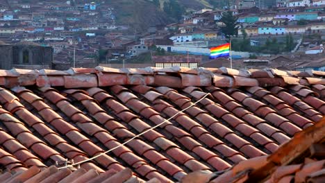 A-flag-of-Cusco-Peru-flies-over-the-down-waving-in-the-wind