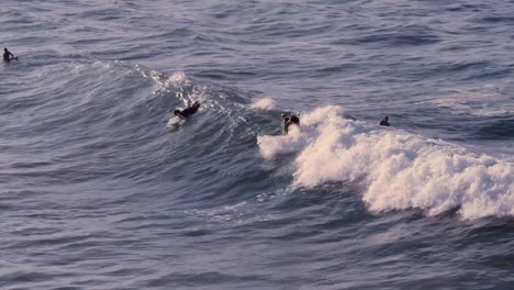 Surfer-catching-a-wave-at-Jaws,-on-the-north-shore-of-Maui,-Hawaii-in-the-early-morning