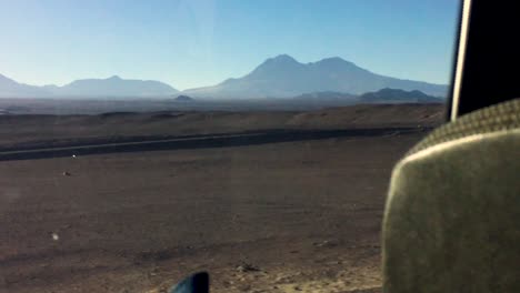 Cruising-in-Atacama-desert,-from-the-back-of-the-bus