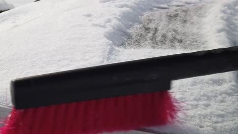 Someone-brushing-snow-off-of-a-solar-panel-at-half-speed