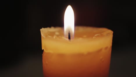 A-small-candle-is-lit-with-a-lighter