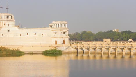 Beautiful-Palace-structure-in-middle-of-the-Lakhota-lake-Jamnagar-city-stock-video-I-Palace-in-lake-with-golden-shine